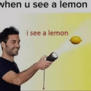 A Man Is Holding A Flashlight And A Lemon Is Flying In The Air Behind Him . GIF