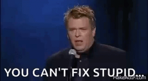 A Man Is Holding A Glass Of Whiskey In Front Of A Microphone And Says `` You Can 'T Fix Stupid '' . GIF
