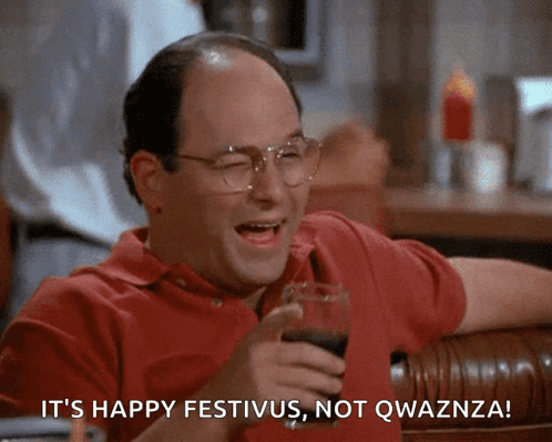 A Man Is Holding A Glass Of Wine And Says It 'S Happy Festivus Not Qwaznza GIF