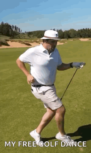A Man Is Holding A Golf Club And Dancing On A Golf Course . GIF