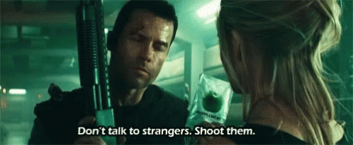 A Man Is Holding A Gun And A Woman Is Holding An Apple . GIF