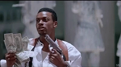 A Man Is Holding A Gun And Holding A Pile Of Money . GIF