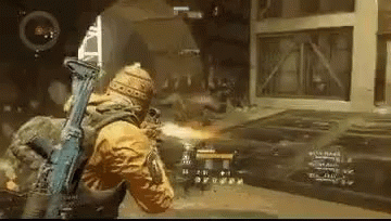 A Man Is Holding A Gun In A Video Game And Shooting A Bullet . GIF