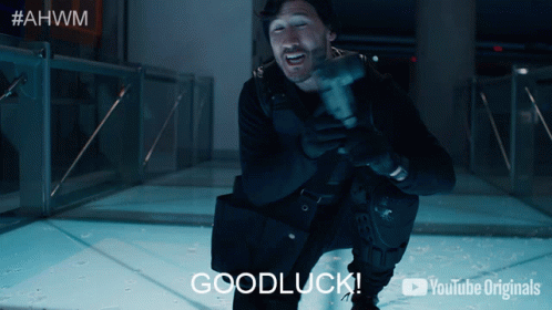 A Man Is Holding A Hammer And Says Goodluck GIF
