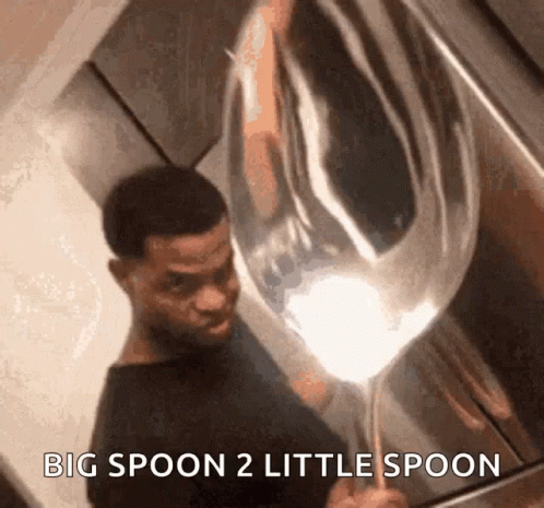 A Man Is Holding A Large Spoon With The Words Big Spoon 2 Little Spoon Below Him GIF