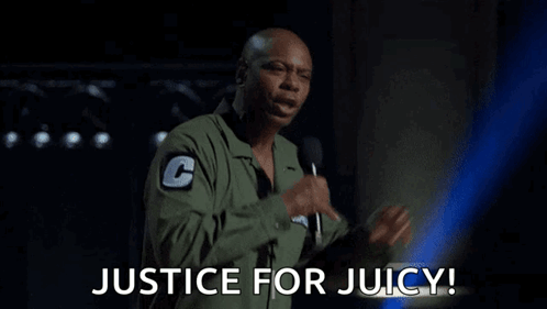 A Man Is Holding A Microphone And Says Justice For Juicy . GIF