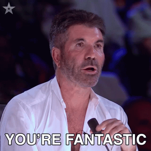 A Man Is Holding A Microphone And Says You 'Re Fantastic GIF