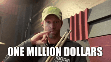 A Man Is Holding A Pair Of Drumsticks And Says " One Million Dollars " GIF