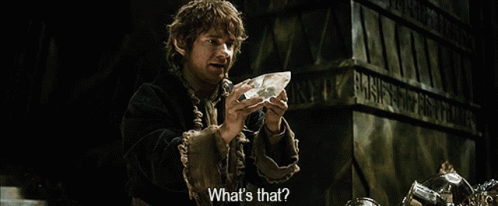 A Man Is Holding A Piece Of Crystal And Asking What 'S That GIF