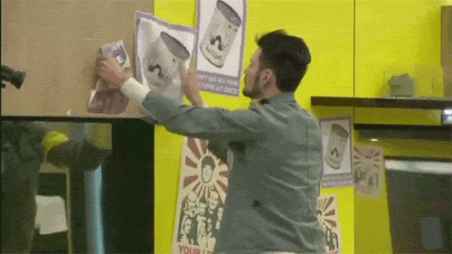 A Man Is Holding A Piece Of Paper That Says Your Life On It GIF