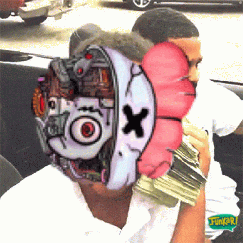 A Man Is Holding A Pile Of Money With A Cartoon Face On His Face .. GIF