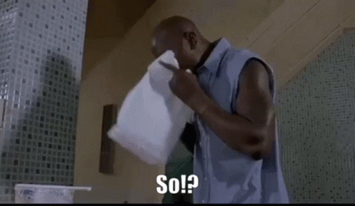 A Man Is Holding A Pillow Over His Face And Says `` So ? '' GIF