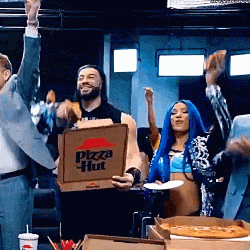 A Man Is Holding A Pizza Hut Box In His Hand GIF