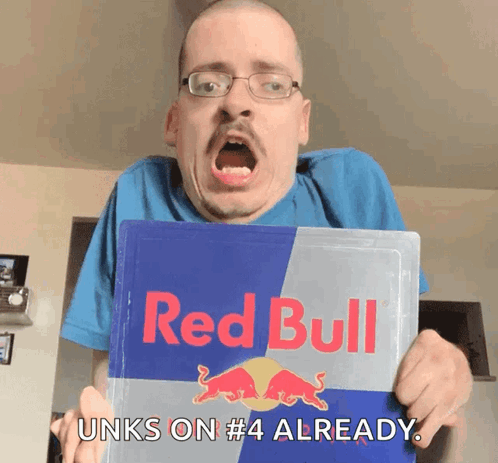 A Man Is Holding A Red Bull Sign And Says " Unks On # 4 Already " GIF