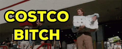 A Man Is Holding A Roll Of Paper Towels In Front Of Costco GIF
