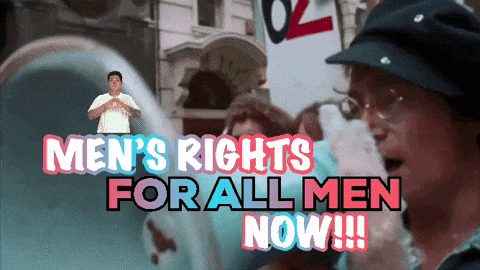 A Man Is Holding A Sign That Says Men 'S Rights For All Men Now GIF