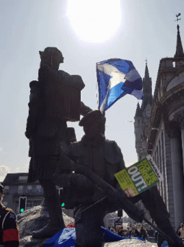 A Man Is Holding A Sign That Says " Out " GIF