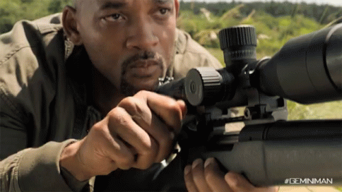 A Man Is Holding A Sniper Rifle With A #Geminiman Watermark GIF