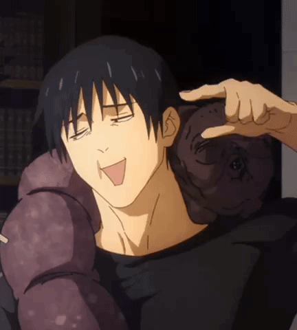 A Man Is Holding A Stuffed Animal On His Shoulder While Making A Funny Face . GIF