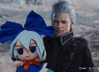 A Man Is Holding A Stuffed Doll With Blue Hair And A Bow . GIF