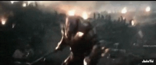 A Man Is Holding A Sword In Front Of A Crowd Of People And The Words Andrevid Are On The Bottom GIF