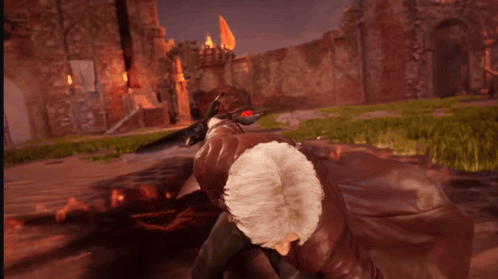 A Man Is Holding A Sword That Is Surrounded By Fire GIF
