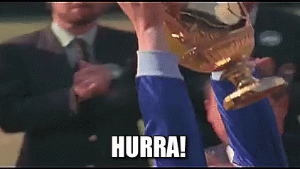 A Man Is Holding A Trophy In His Hand With The Words Hurra Written On The Bottom . GIF
