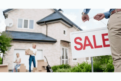 A Man Is Holding A White Sign That Says Sale GIF