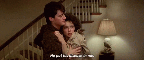 A Man Is Holding A Woman In His Arms And Says `` He Put His Disease In Me . '' GIF