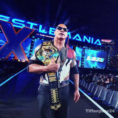 A Man Is Holding A Wrestling Championship Belt In Front Of A Sign That Says ' Wrestling ' GIF