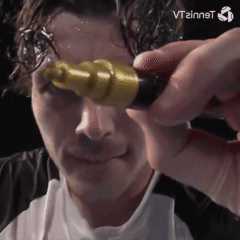 A Man Is Holding A Yellow Object In Front Of His Face And The Word Vtzinnst Is Visible In The Corner GIF