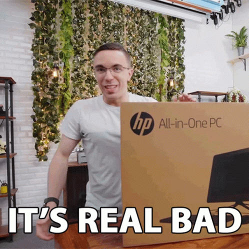 A Man Is Holding An Hp All-In-One Pc Box And Says It 'S Real Bad GIF