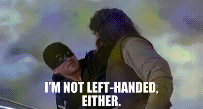 A Man Is Holding Another Man 'S Hand And Says `` I 'M Not Left-Handed , Either . '' GIF