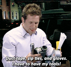 a man is holding duct tape zip ties and gloves and says " i have to have my tools "