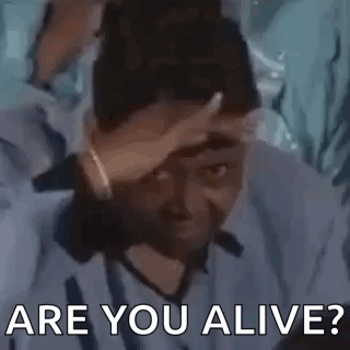 A Man Is Holding His Hand To His Forehead And Asking Are You Alive . GIF