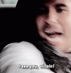A Man Is Hugging A Woman And Saying I See You , Villain ! GIF