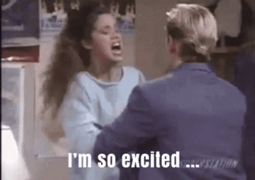 A Man Is Hugging A Woman Who Is Screaming And Saying `` I 'M So Excited ... '' GIF