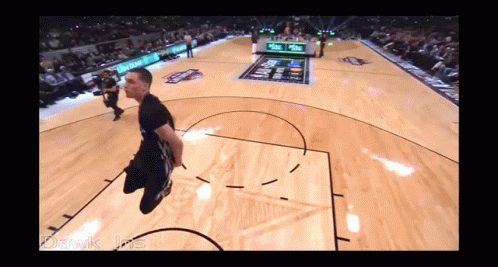 A Man Is Jumping In The Air On A Basketball Court With The Words Dawik Jrs Below Him GIF
