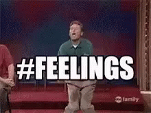 A Man Is Jumping In The Air With The Words `` Feelings '' Written On The Screen Behind Him . GIF