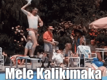 A Man Is Jumping Into A Swimming Pool With The Words Mele Kalikimaka Behind Him GIF