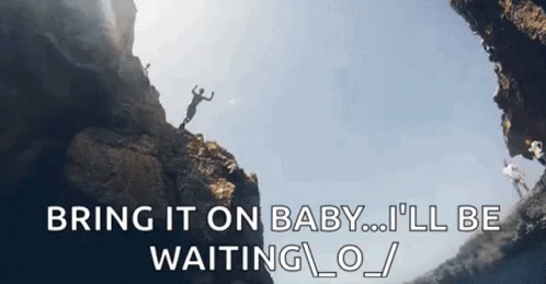 A Man Is Jumping Off A Cliff With The Words `` Bring It On Baby ... I 'Ll Be Waiting . '' GIF