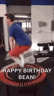 A Man Is Jumping On A Trampoline In A Gym With The Words `` Happy Birthday Bean '' . GIF