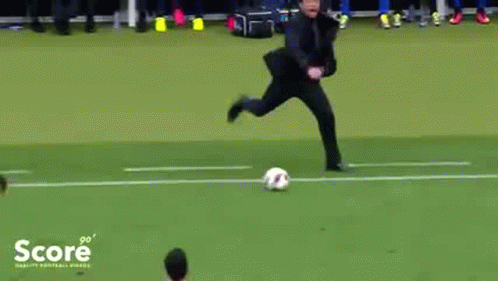 A Man Is Kicking A Soccer Ball On A Field With The Word Score On The Bottom Left GIF