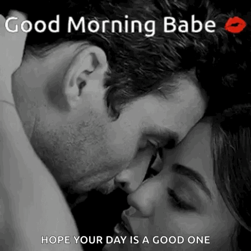 A Man Is Kissing A Woman On The Forehead . GIF