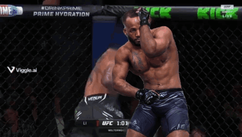 A Man Is Kneeling Down In A Cage With The Time Of 0:59 On The Screen GIF