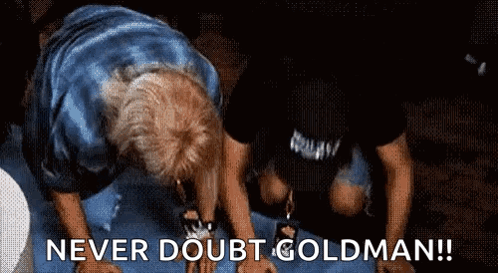 a man is kneeling down with the words never doubt goldman written on the bottom