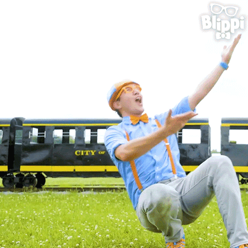 A Man Is Kneeling In Front Of A Train That Says City On It GIF