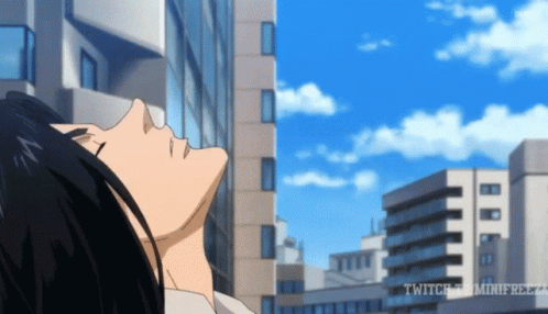 A Man Is Laying Down In Front Of A City Skyline With The Words Twitch On The Bottom Right Corner GIF
