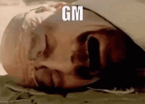 A Man Is Laying Down With His Eyes Closed And A Tear Coming Out Of His Nose . GIF