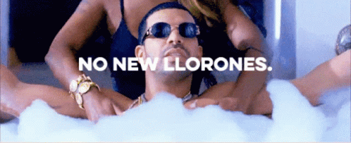 A Man Is Laying In A Bathtub With The Words No New Llorones GIF